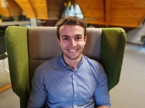 Connor Tebb, Project Engineer from Atmos International sitting in green chair