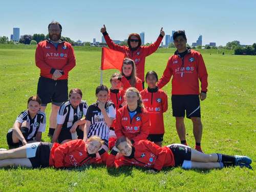 Haslingden Girls and Ladies Football club wearing training kit sponsored by Atmos International