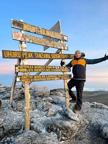 Sales and Senior Research Engineer Harry Smith at the summit of Kilimanjaro