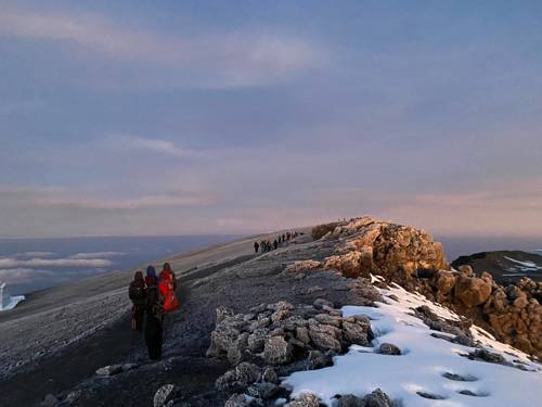 An image of a sunset with snow on the ground during Sales and Senior Research Engineer Harry Smith's ascent of Kilimanjaro
