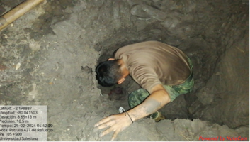 A man searching the theft site for the location of the illegal tapping point in Ecuador