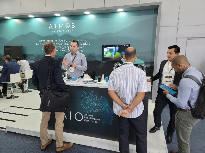 Sales and Senior Research Engineer Harry Smith and Sales Engineer Harry Smith speaking with event attendees at Rio Pipeline Conference & Exhibition 2023