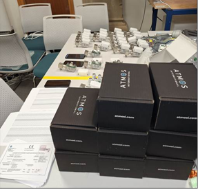 An image of multiple boxes with Atmos International's logo printed on them. Each box contains an Atmos Pit Sentry unit
